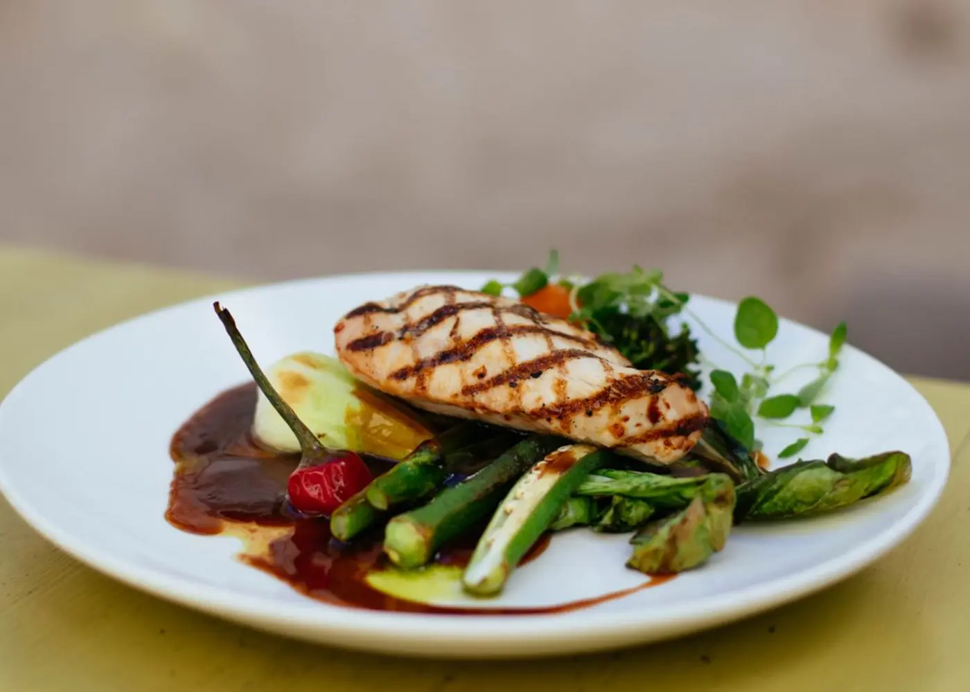 A chef plating a fresh dish in the Eat Better Meals kitchen